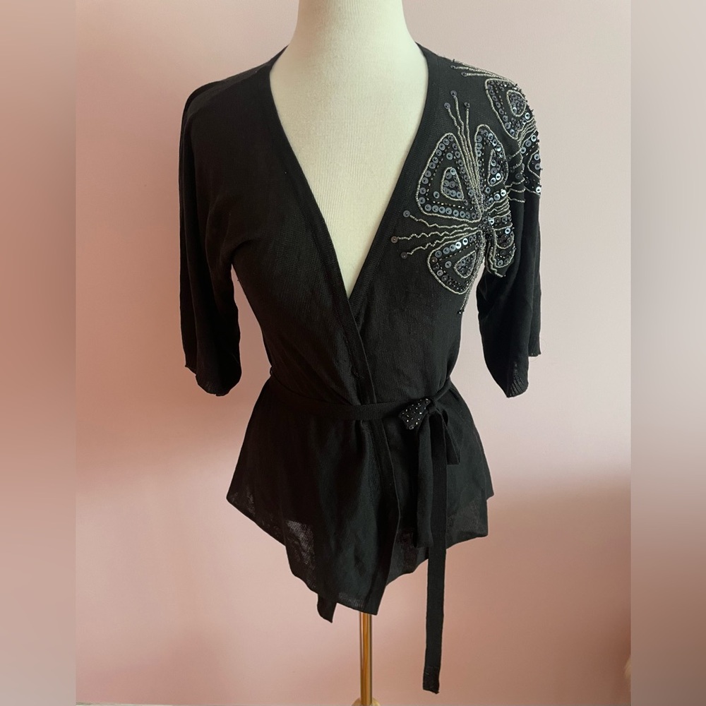 Elegant Black Wrap Top with Butterfly Embellishments